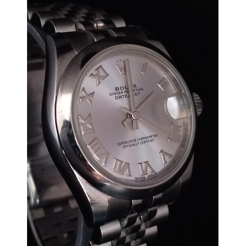 151 - A  ROLEX OYSTER PERPETUAL DATEJUST IN STAINLESS STEEL WITH SILVERTONE DIAL , ROMAN NUMERALS AND WITH... 