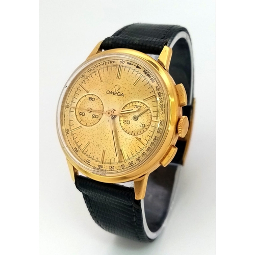 158 - A VINTAGE 18K GOLD OMEGA TACHYMETRE , WITH 2 SUBDIALS AND STOP WATCH FACILITY ON ORIGINAL OMEGA BLAC... 