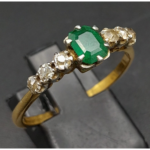 177 - A Vintage 18K Yellow Gold Diamond and Emerald Ring. Central emerald with three old cut diamonds on e... 