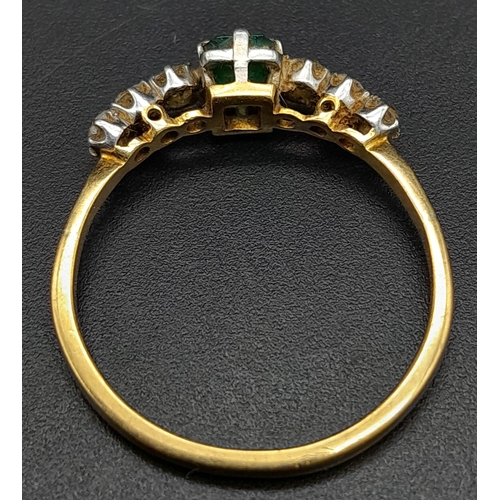 177 - A Vintage 18K Yellow Gold Diamond and Emerald Ring. Central emerald with three old cut diamonds on e... 