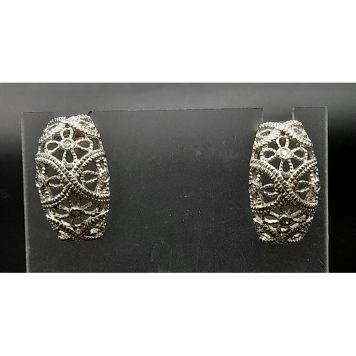 185 - A PAIR OF 14K WHITE GOLD DIAMOND SET FILIGREE EARRINGS. TOTAL WEIGHT  6.3G.