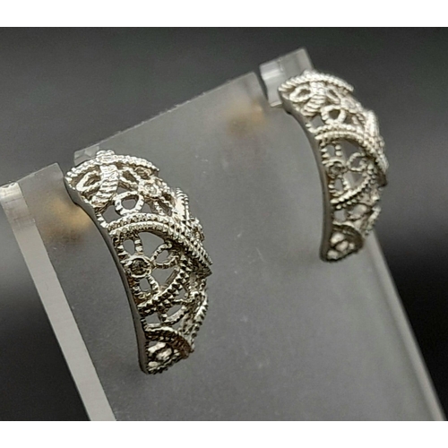 185 - A PAIR OF 14K WHITE GOLD DIAMOND SET FILIGREE EARRINGS. TOTAL WEIGHT  6.3G.