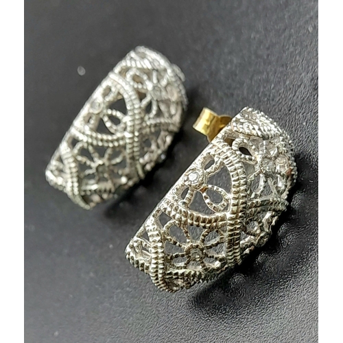 185 - A PAIR OF 14K WHITE GOLD DIAMOND SET FILIGREE EARRINGS. TOTAL WEIGHT  6.3G.