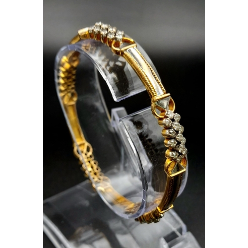 19 - A 18K YELLOW GOLD 2CT DIAMOND SET BANGLE. DIAMETER 6 CM. TOTAL WEIGHT 20.6G.