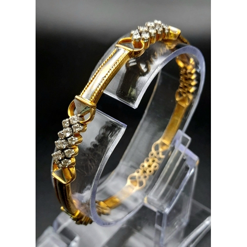 19 - A 18K YELLOW GOLD 2CT DIAMOND SET BANGLE. DIAMETER 6 CM. TOTAL WEIGHT 20.6G.