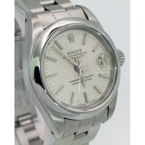 205 - A LADIES ROLEX OYSTER PERPETUAL DATEJUST IN STAINLESS STEEL WITH SILVERTONE DIAL AND IN AS NEW CONDI... 