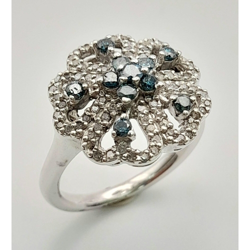 298 - A GORGEOUS 10K WHITE GOLD DIAMOND CLUSTER RING IN FLORAL DESIGN. TOTAL WEIGHT 6G. SIZE O.