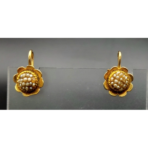 305 - A VINTAGE PAIR OF 18K YELLOW GOLD SEED PEARL IN FLOWER DESIGN EARRINGS. TOTAL WEIGHT 2.6G