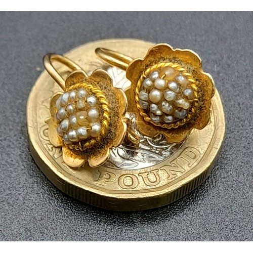 305 - A VINTAGE PAIR OF 18K YELLOW GOLD SEED PEARL IN FLOWER DESIGN EARRINGS. TOTAL WEIGHT 2.6G