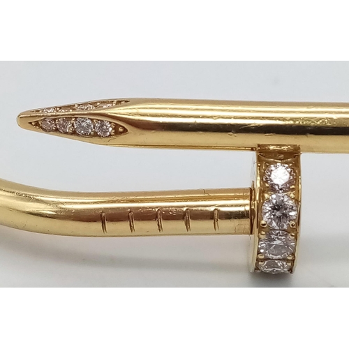 5 - A 18K YELLOW GOLD 0.45CT DIAMOND SET CARTIER STYLE NAIL BANGLE. TOTAL WEIGHT 34.34G. THE WIDEST INNE... 