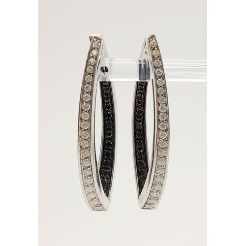 78 - A Pair of Designer Palmiero 18K White Gold, Black and White Diamond Elongated Hoop Earrings. 0.93ct ... 