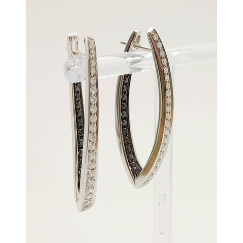 78 - A Pair of Designer Palmiero 18K White Gold, Black and White Diamond Elongated Hoop Earrings. 0.93ct ... 