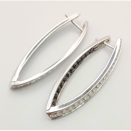 78 - A Pair of Designer Palmiero 18K White Gold, Black and White Diamond Elongated Hoop Earrings. 0.93ct ... 