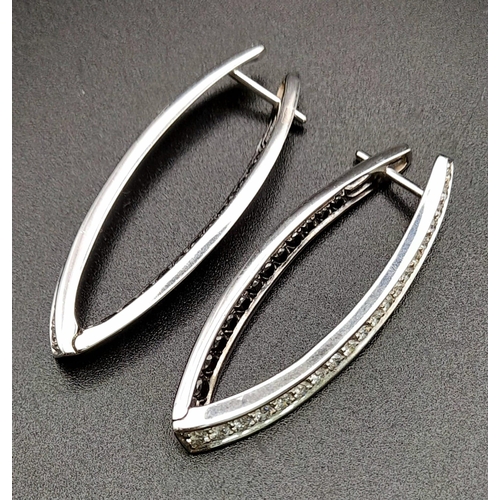 78 - A Pair of Designer Palmiero 18K White Gold, Black and White Diamond Elongated Hoop Earrings. 0.93ct ... 