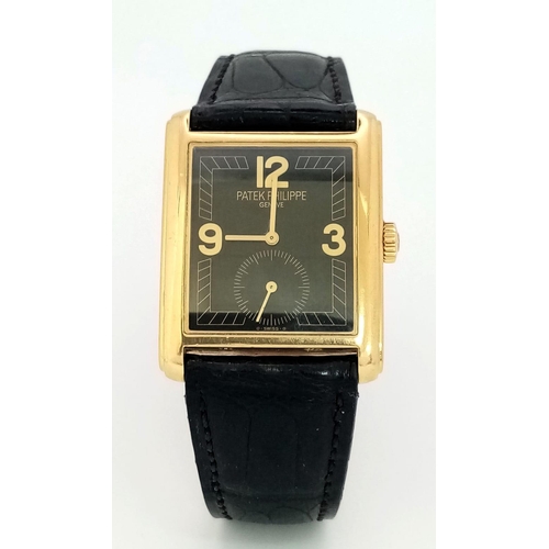 79 - A PATEK PHILIPPE VINTAGE 18K GOLD TANK STYLE WATCH WITH A SUBDIAL AND GEOMETRIC DESIGN ON THE FACE ,... 