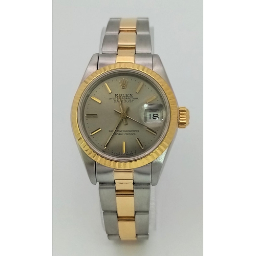 93 - A LADIES BI-METAL ROLEX OYSTER PERPETUAL DATEJUST WITH LATEST STYLE STRAP , SILVERTONE DIAL IN AS NE... 