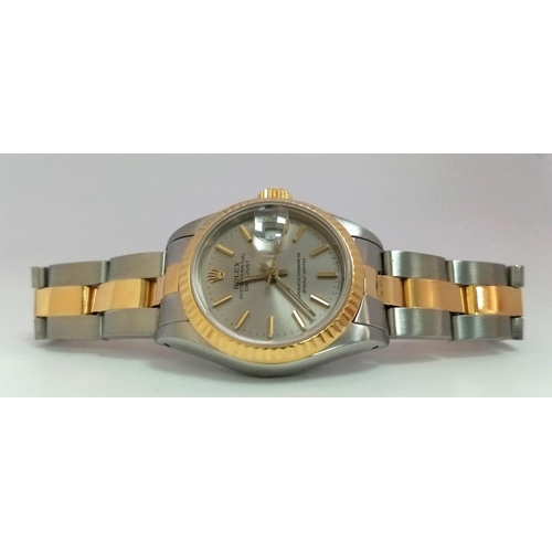 93 - A LADIES BI-METAL ROLEX OYSTER PERPETUAL DATEJUST WITH LATEST STYLE STRAP , SILVERTONE DIAL IN AS NE... 