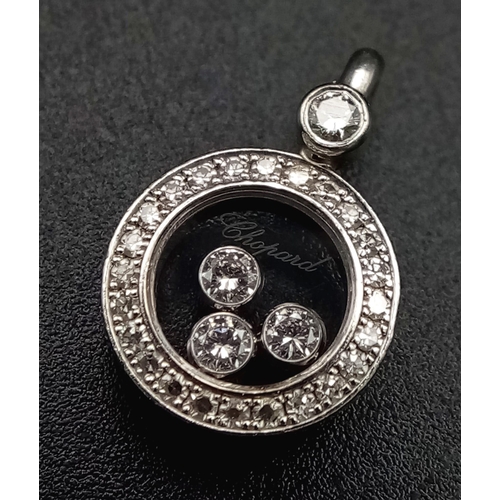 121 - A Chopard Happy Diamond 18K White Gold Pendant. Three quality round cut floating diamonds surrounded... 