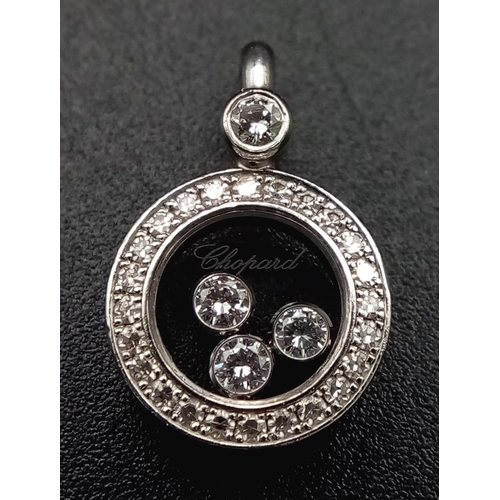 121 - A Chopard Happy Diamond 18K White Gold Pendant. Three quality round cut floating diamonds surrounded... 