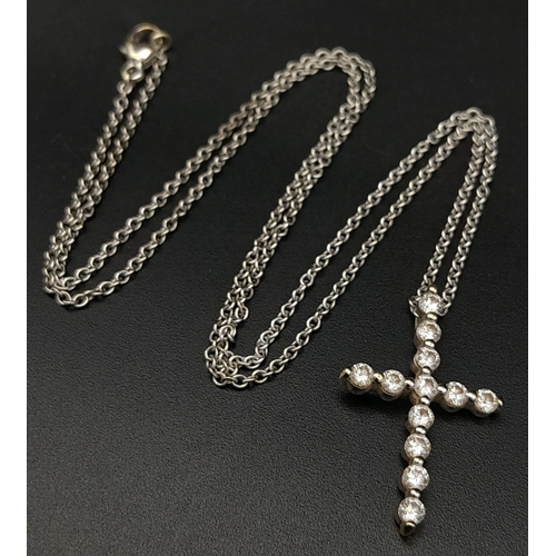 204 - An 18K White Gold and Diamond Cross Pendant on an 18K White Gold Necklace. 3cm - pendant with 12 rou... 