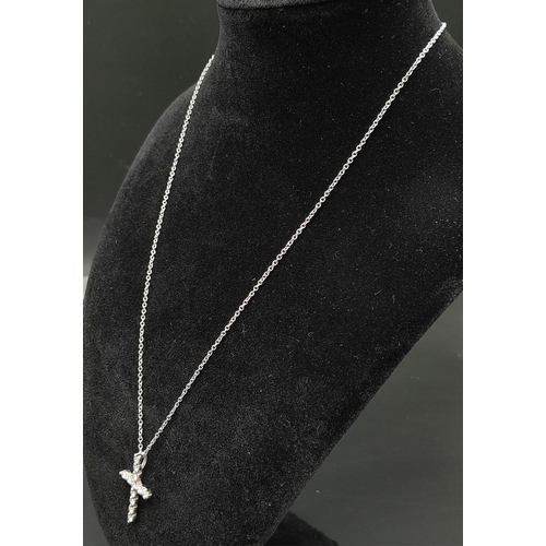 204 - An 18K White Gold and Diamond Cross Pendant on an 18K White Gold Necklace. 3cm - pendant with 12 rou... 