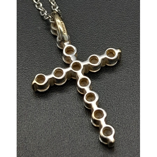 204 - An 18K White Gold and Diamond Cross Pendant on an 18K White Gold Necklace. 3cm - pendant with 12 rou... 