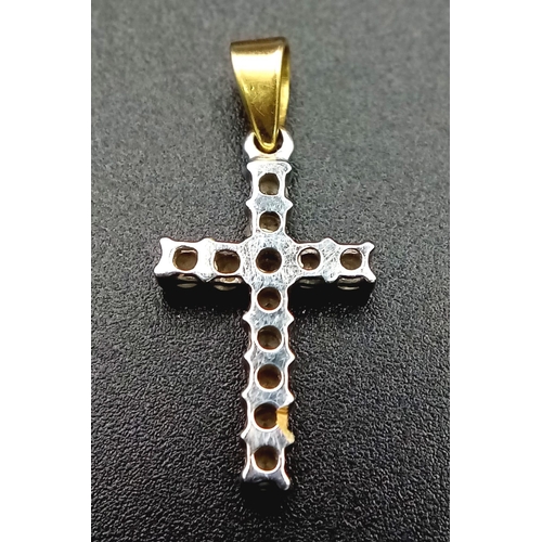 211 - A Gold and Platinum Diamond Cross Pendant. 12 round cut diamonds - each representing a disciple. 1.5... 