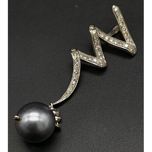 225 - A Platinum, Diamond and Grey Tahitian Pearl Spiral Pendant.
6cm. 5.12g total weight. Ref: 13890