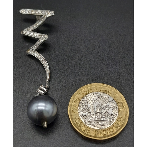 225 - A Platinum, Diamond and Grey Tahitian Pearl Spiral Pendant.
6cm. 5.12g total weight. Ref: 13890