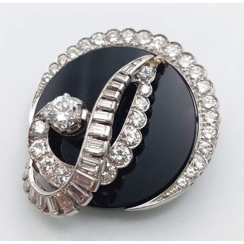 240 - An unusual 18 K white gold brooch or pendant with a beautiful design loaded with brilliant round cut... 