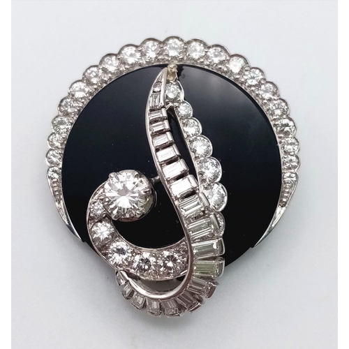 240 - An unusual 18 K white gold brooch or pendant with a beautiful design loaded with brilliant round cut... 