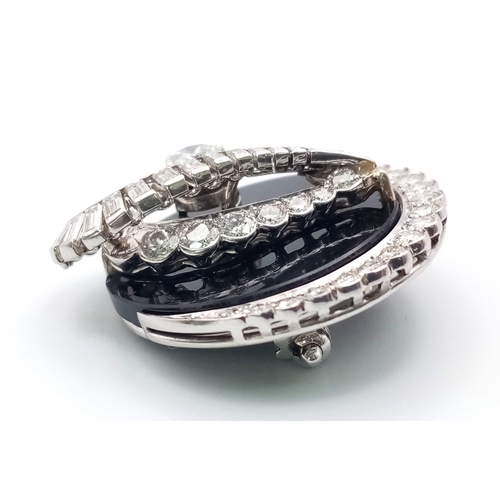 240 - An unusual 18 K white gold brooch or pendant with a beautiful design loaded with brilliant round cut... 