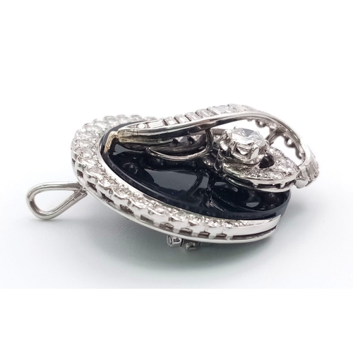 240 - An unusual 18 K white gold brooch or pendant with a beautiful design loaded with brilliant round cut... 