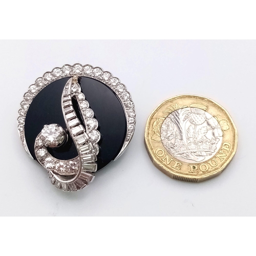 240 - An unusual 18 K white gold brooch or pendant with a beautiful design loaded with brilliant round cut... 