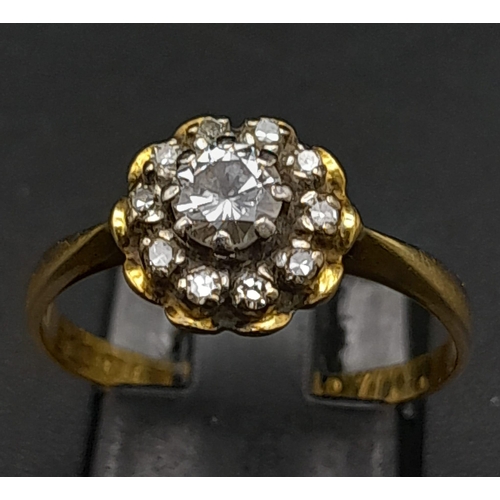 270 - A Vintage 18K Yellow Gold Diamond Ring. Central round cut diamond surrounded by a halo of diamonds. ... 