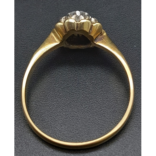 270 - A Vintage 18K Yellow Gold Diamond Ring. Central round cut diamond surrounded by a halo of diamonds. ... 