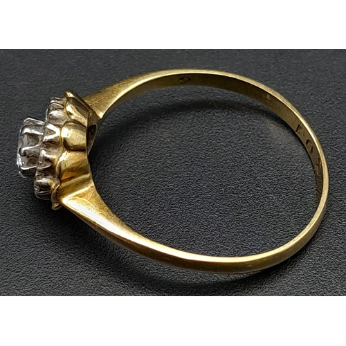 270 - A Vintage 18K Yellow Gold Diamond Ring. Central round cut diamond surrounded by a halo of diamonds. ... 