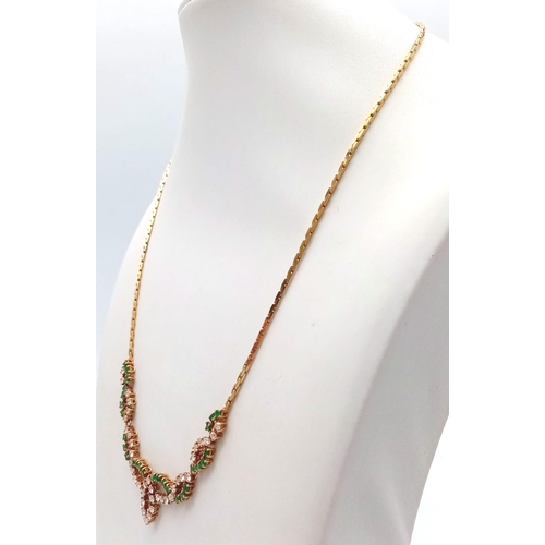 135 - An 18K Yellow Gold Diamond and Green Stone Necklace. 40cm length with a diamond drop. 36 round cut d... 