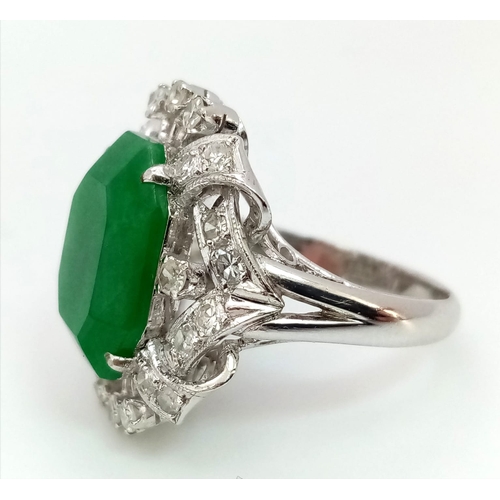 36 - An Art Deco Style 18K White Gold, Jade and Diamond Ring. Large octagonal cut jade with a healthy sur... 