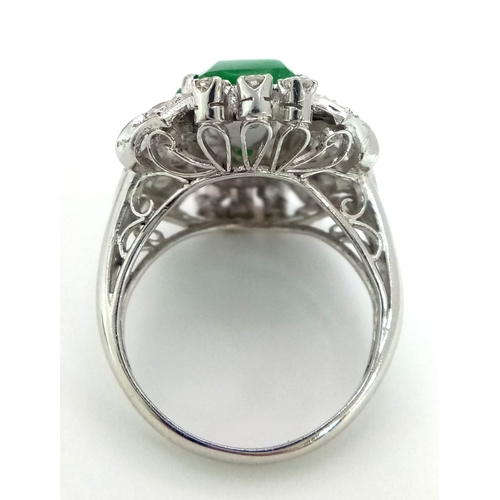 36 - An Art Deco Style 18K White Gold, Jade and Diamond Ring. Large octagonal cut jade with a healthy sur... 