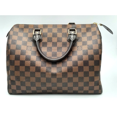 44 - A Louis Vuitton Speedy 30 ebony damier canvas Handbag. Accessories to include padlock and key. Come ... 