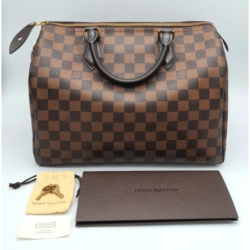 44 - A Louis Vuitton Speedy 30 ebony damier canvas Handbag. Accessories to include padlock and key. Come ... 