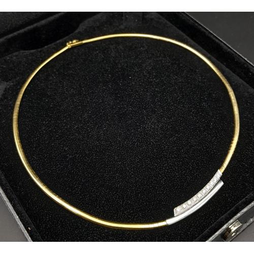 92 - An 18K Yellow Gold and Diamond Choker Necklace. Rich yellow gold gives way to ten quality round cut ... 