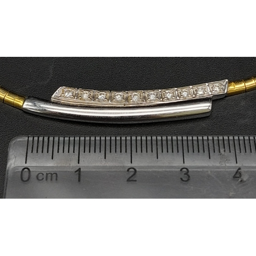 92 - An 18K Yellow Gold and Diamond Choker Necklace. Rich yellow gold gives way to ten quality round cut ... 