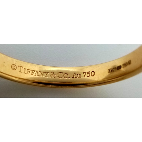 232 - An 18K Yellow Gold Tiffany and Co. Band Ring. Size Q. 3.65g.
Ref: 13947