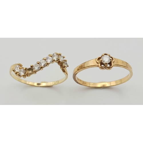 296 - Two 9 K yellow gold rings with cubic zirconia, size: J, total weight: 1.6 g.