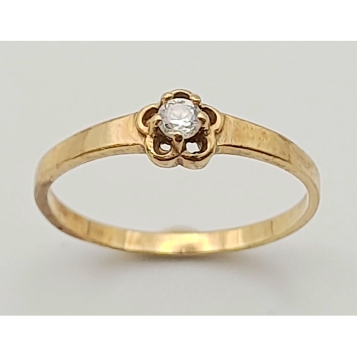 296 - Two 9 K yellow gold rings with cubic zirconia, size: J, total weight: 1.6 g.