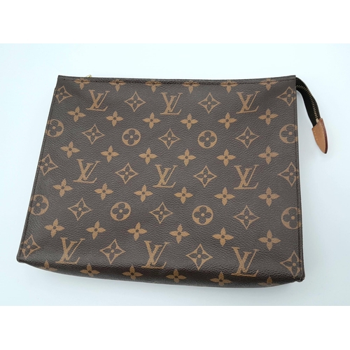 101 - The LOUIS VUITTON Toiletry 26 Zip Pouch in Monogram. Golden-tone zip closure with leather tab. Inter... 