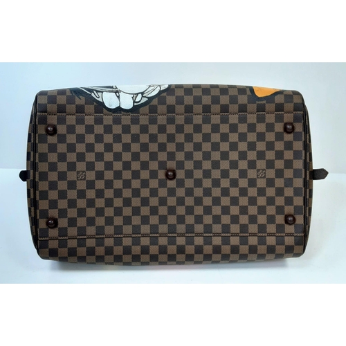 Sold at Auction: A Rare Louis Vuitton 'Tweedy Pie' Speedy Luggage Bag.  Checked LV canvas exterior with Tweedy Pie decoration. Red spacious textile  interior with zipped compartment. Please see photos for conditions.