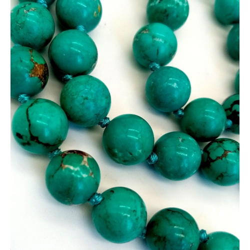 291 - An Exquisite Blue Turquoise and Baroque Pearl Necklace. 10mm turquoise beads lead to a Baroque Drop!... 